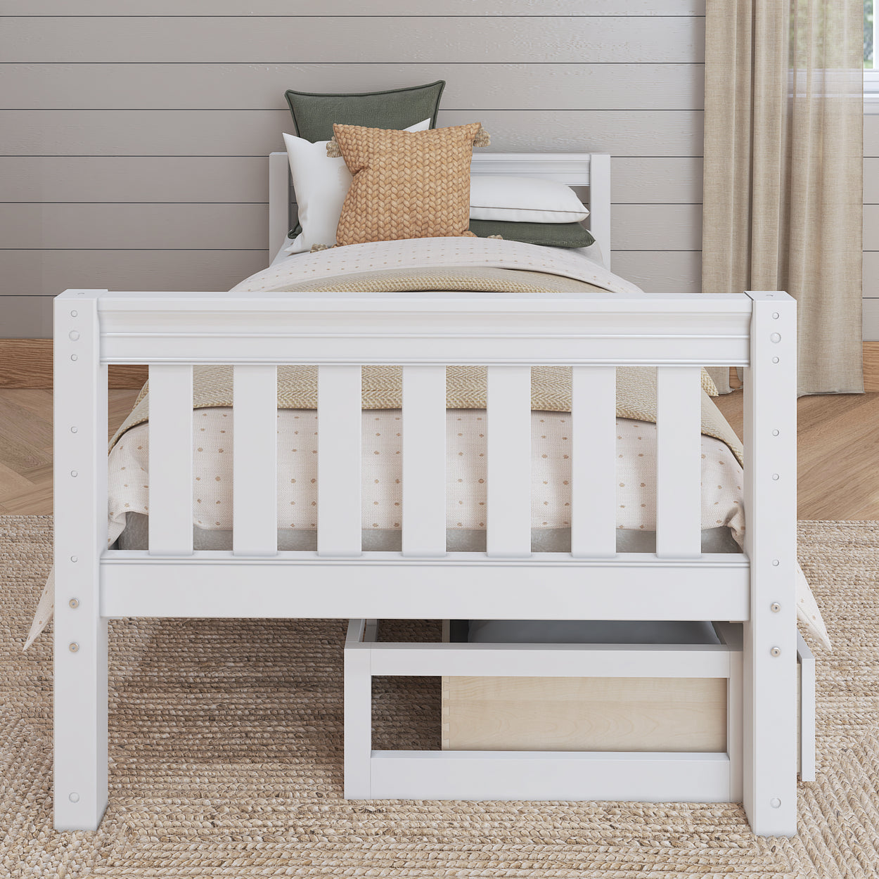 White wooden bed with storage drawer, layered bedding, and decorative pillows in a cozy bedroom setting.