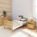 Scandinavian bedroom with natural wood bed and dresser, white shiplap accent wall, neutral bedding, potted plants and linen curtains