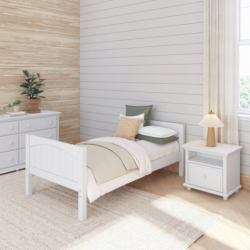Cozy neutral modern bedroom interior with white twin bed, shiplap accent wall, white dresser, bedside lamp and potted plants