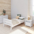 Cozy neutral bedroom with white wooden bed, shiplap accent wall, grasscloth wallpaper, natural fiber rug, nightstand lamp and potted plants