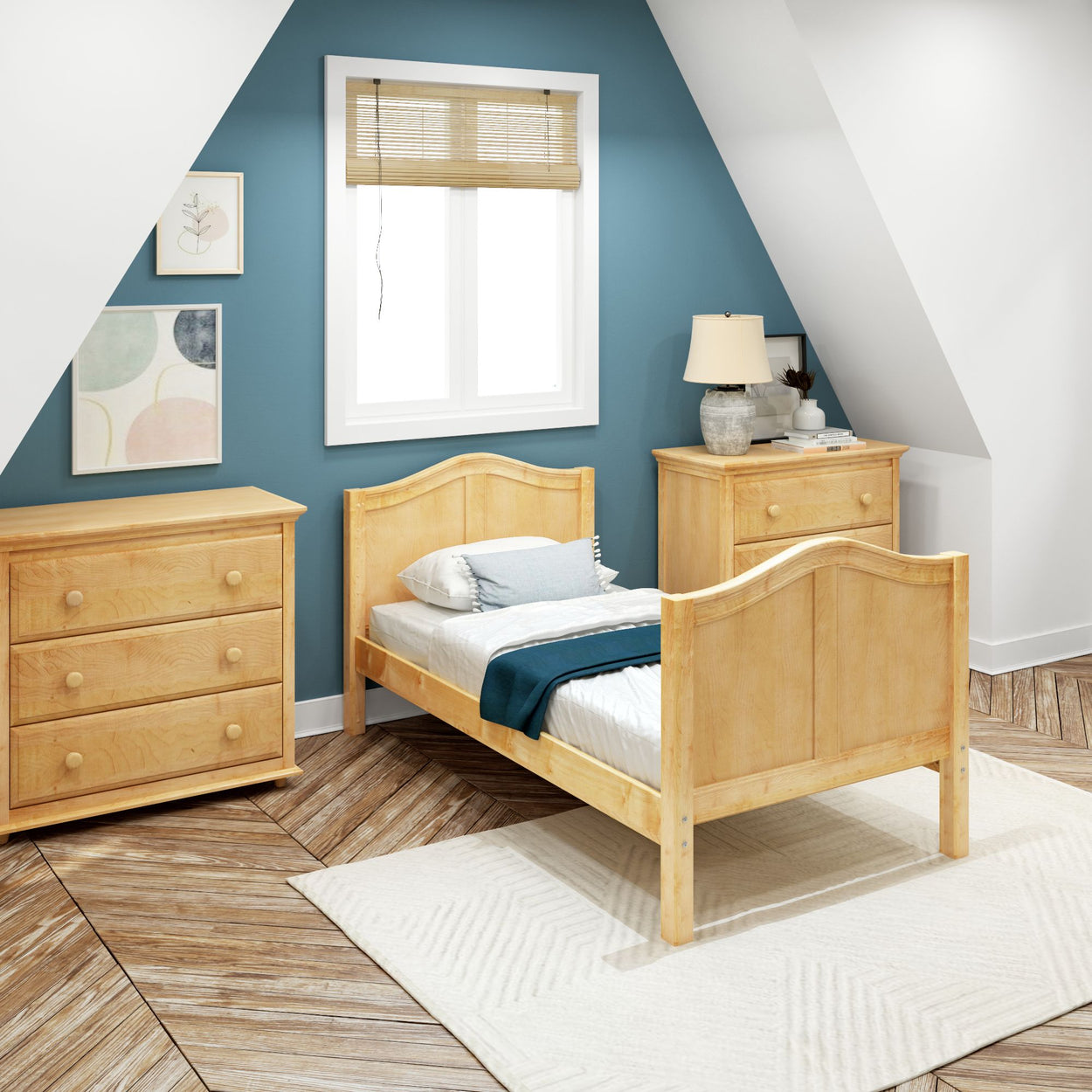 Cozy attic bedroom with wooden furniture and blue accent wall.