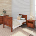 Cozy neutral bedroom with wooden twin bed, shiplap accent wall, natural woven rug, potted plants and wooden nightstand.
