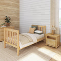 Neutral nursery bedroom interior with wooden twin bed, shiplap white accent wall, grasscloth wallpaper, natural decor, bedside lamp and potted plants