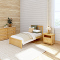 Minimalist bedroom with light wood bed and dresser, neutral bedding, textured beige shiplap wall, potted plants and soft natural light