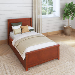 Wooden single bed with decorative pillows in modern bedroom.