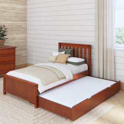 Wooden trundle bed with pull-out mattress in a cozy bedroom setting.