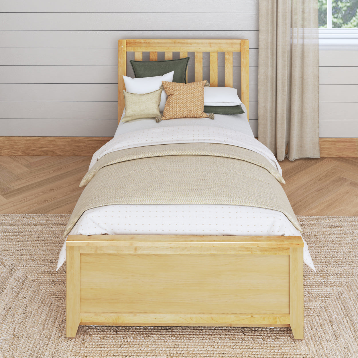 Single wooden bed with beige bedding and decorative pillows in a cozy, modern bedroom setting.
