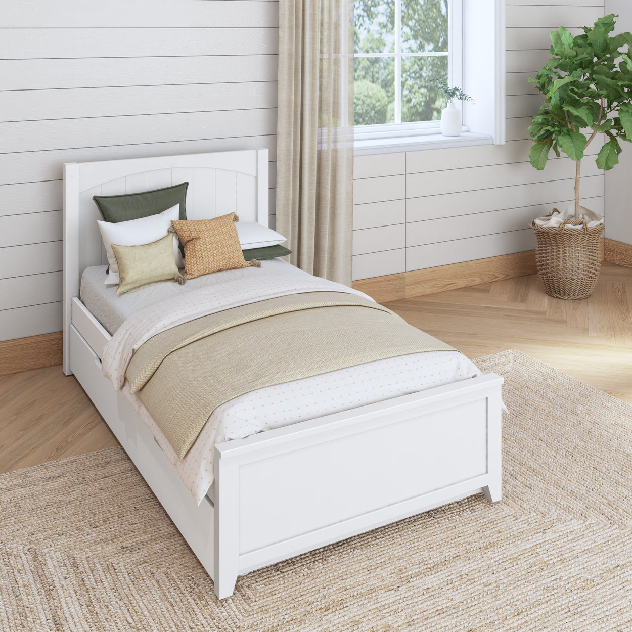 White wooden bed with beige and green pillows in a cozy, modern bedroom with natural light and a houseplant.