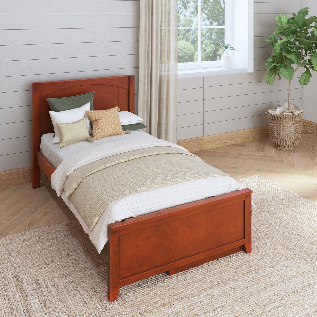 Single wooden bed with cozy throw pillows and neutral bedding in a stylish modern bedroom.