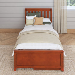 Single wooden bed with cozy pillows and beige bedding in a minimalist bedroom.