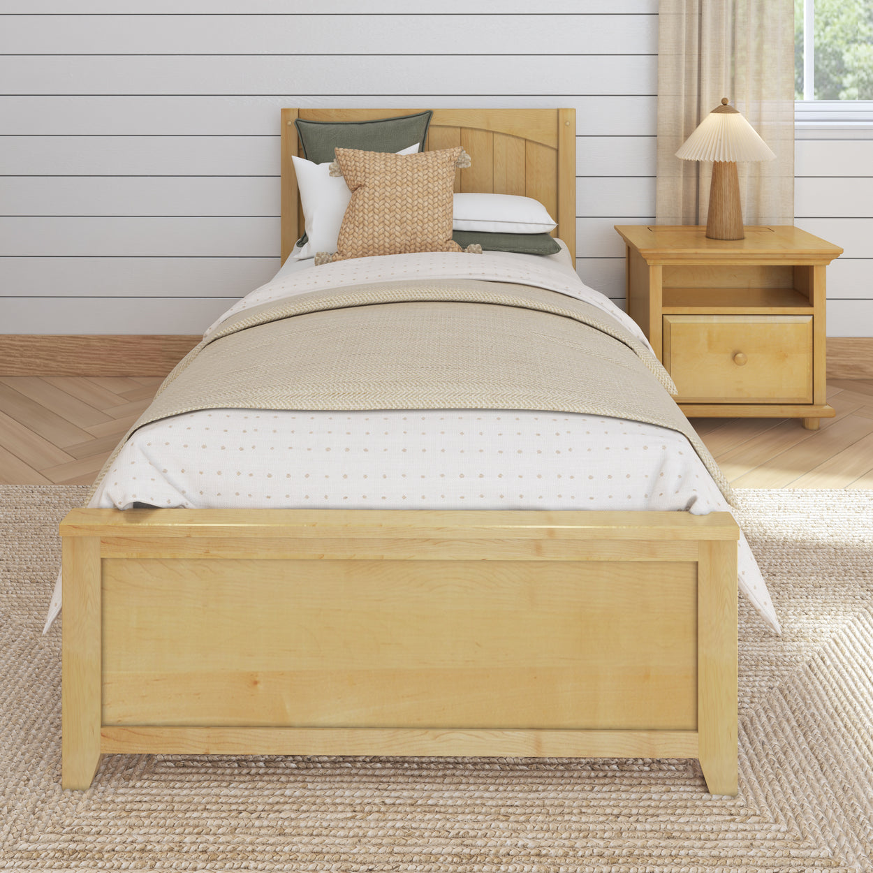 Single wooden bed with beige bedding and nightstand in a cozy bedroom setting.