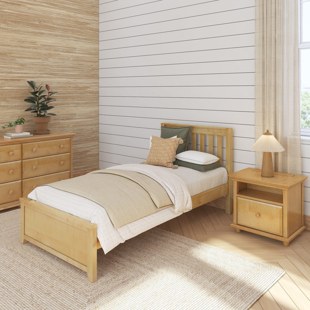 Cozy neutral bedroom with white shiplap accent wall, natural wood bed and nightstand, woven rug and potted plants