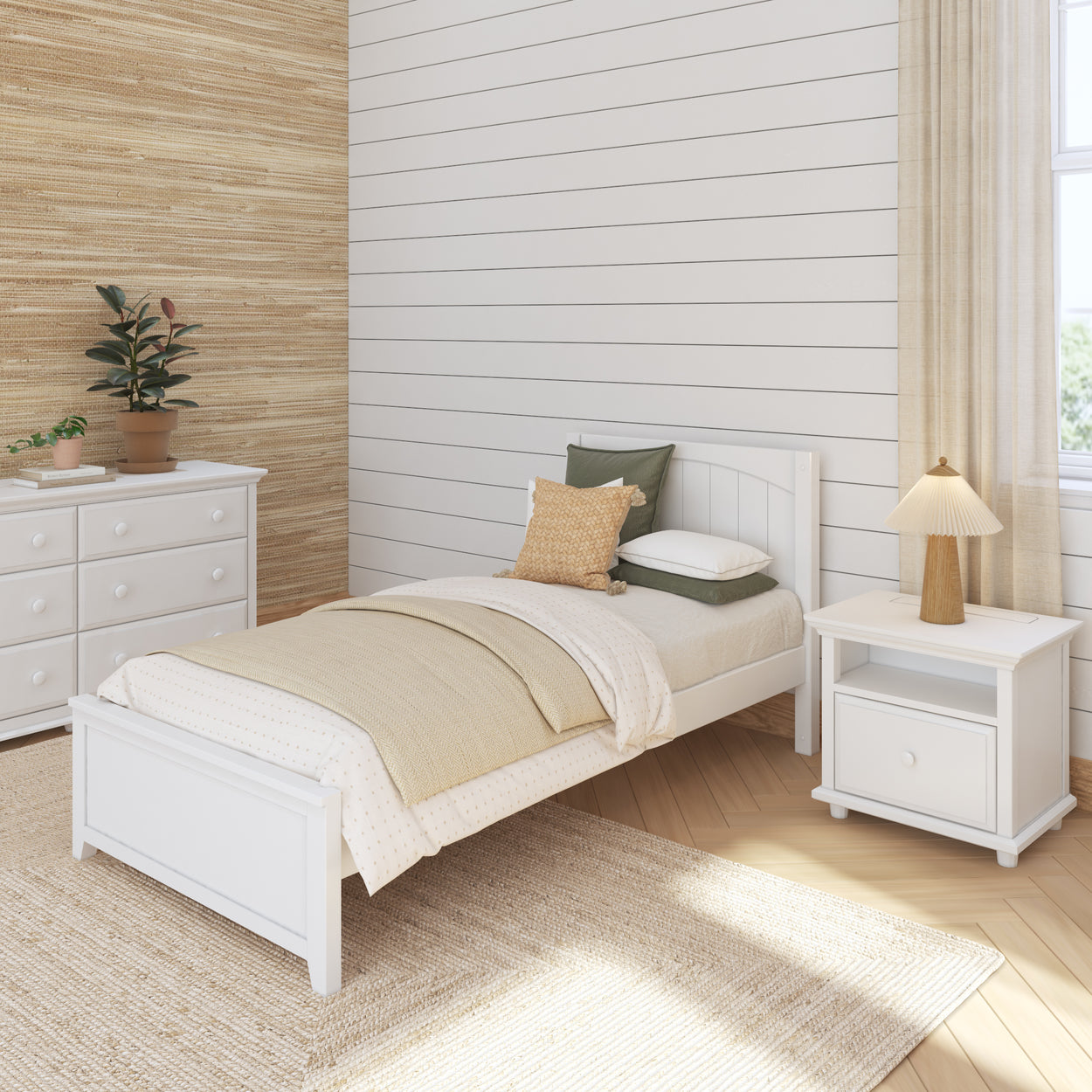 Minimalist bedroom design with white wooden bed, natural fiber rug, dresser, nightstand, and indoor plant.