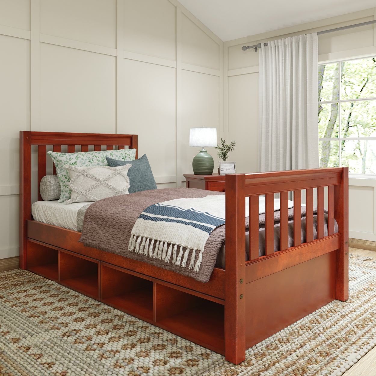 Wooden daybed with storage drawers in a cozy bedroom setting.
