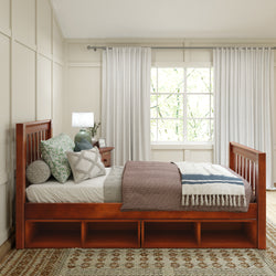 Cozy bedroom with a wooden bed frame featuring storage, adorned with decorative pillows and a soft blanket, complemented by natural light from a large window.