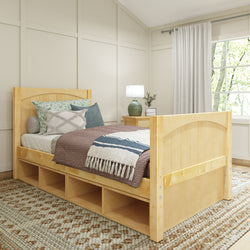 Wooden daybed with storage drawers, cozy bedding, and decorative pillows in a bright, modern bedroom.