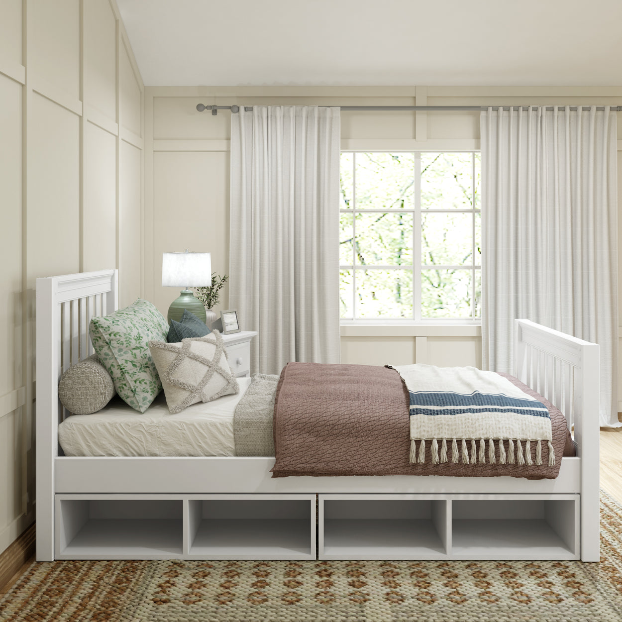 Elegant bedroom interior with white daybed, cozy pillows, and large window with curtains.
