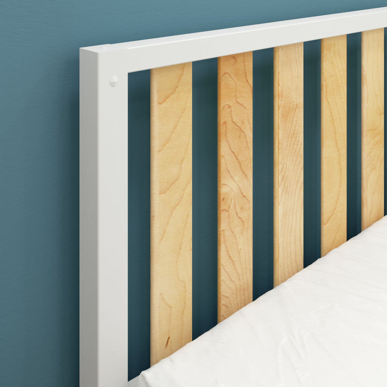 Wooden and metal headboard against teal wall, featuring vertical slats, contemporary bedroom design.