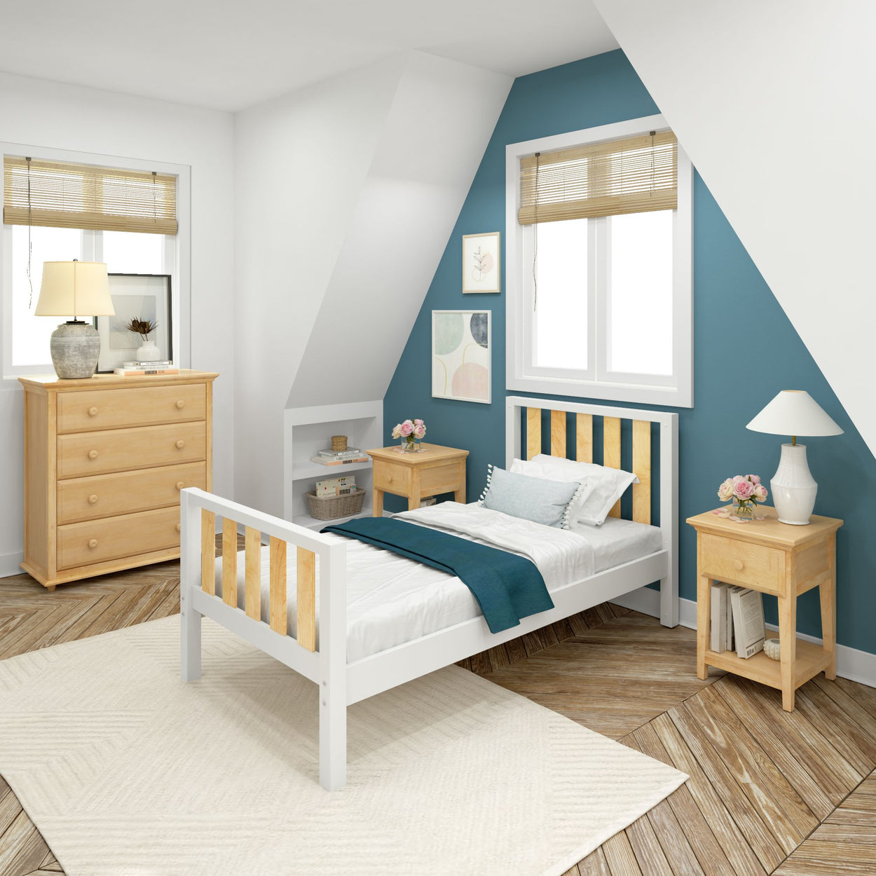 Cozy modern bedroom with blue accent wall, white bed, wooden furniture, and natural light.
