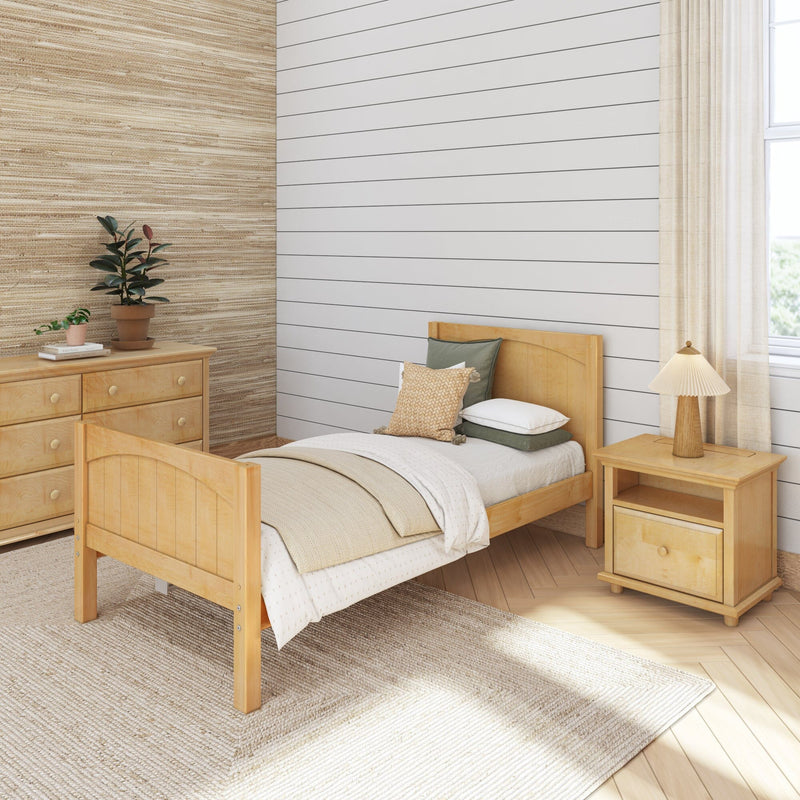 Cozy neutral bedroom with light wood single bed, shiplap accent wall, textured wallpaper, bedside table lamp and potted plants