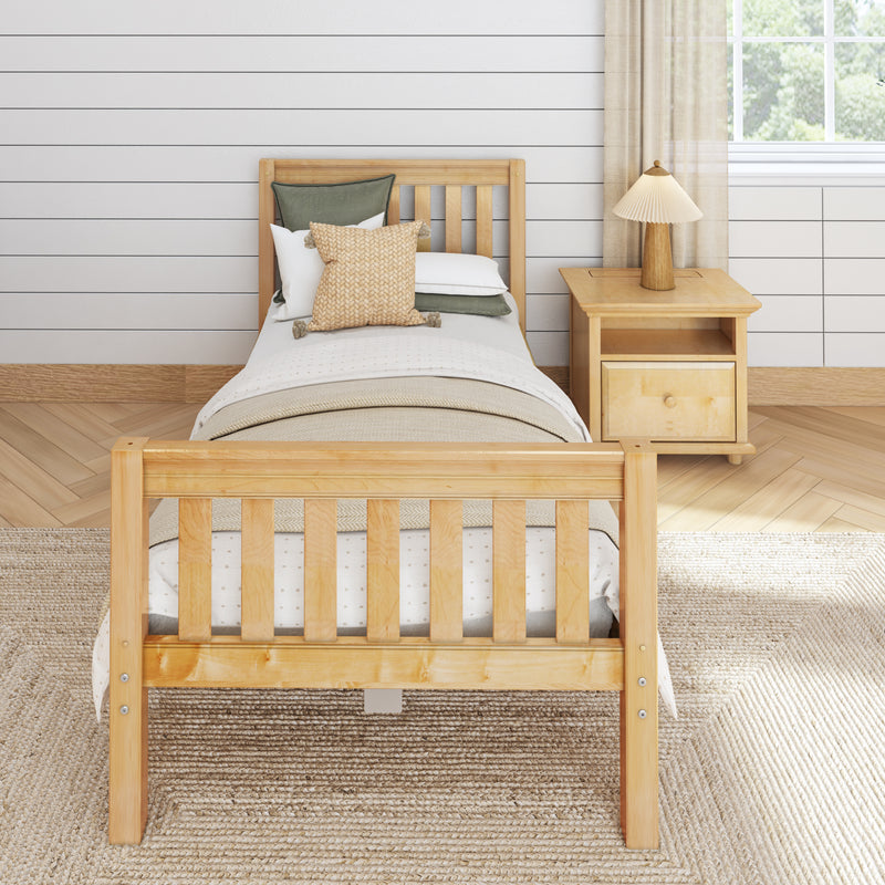 Minimalist Scandinavian twin bedroom with natural wood bed, beige knitted accent pillow and green cushions, wooden nightstand with lamp against white shiplap wall