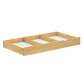 Wooden underbed storage drawer with compartments for organizing items in a modern bedroom.
