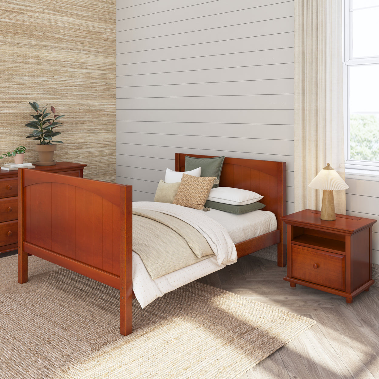 Wooden bed frame with pillows and bedding in a cozy bedroom featuring a nightstand and warm neutral decor.