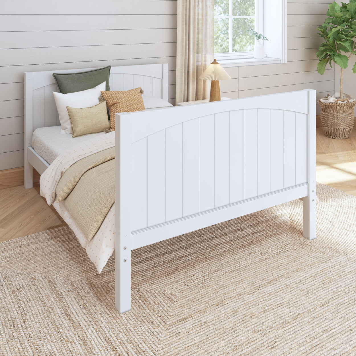 White wooden bed frame in cozy bedroom with neutral decor and natural light.