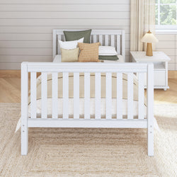 Modern white wooden bed frame with decorative pillows in a cozy bedroom setting.