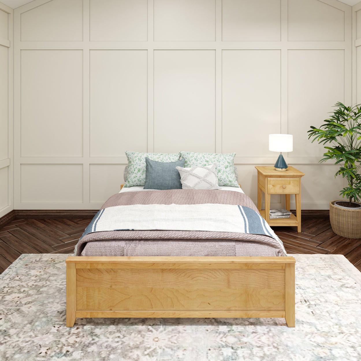 Cozy bedroom with wooden bed frame, plush pillows, and a bedside table with a lamp, creating a tranquil and inviting space.