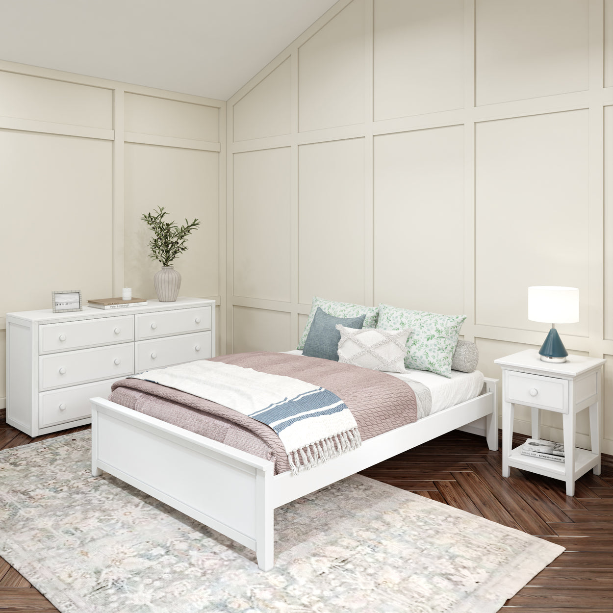 Cozy modern bedroom design with white furniture, featuring a double bed, dresser, and nightstand in a softly lit space.