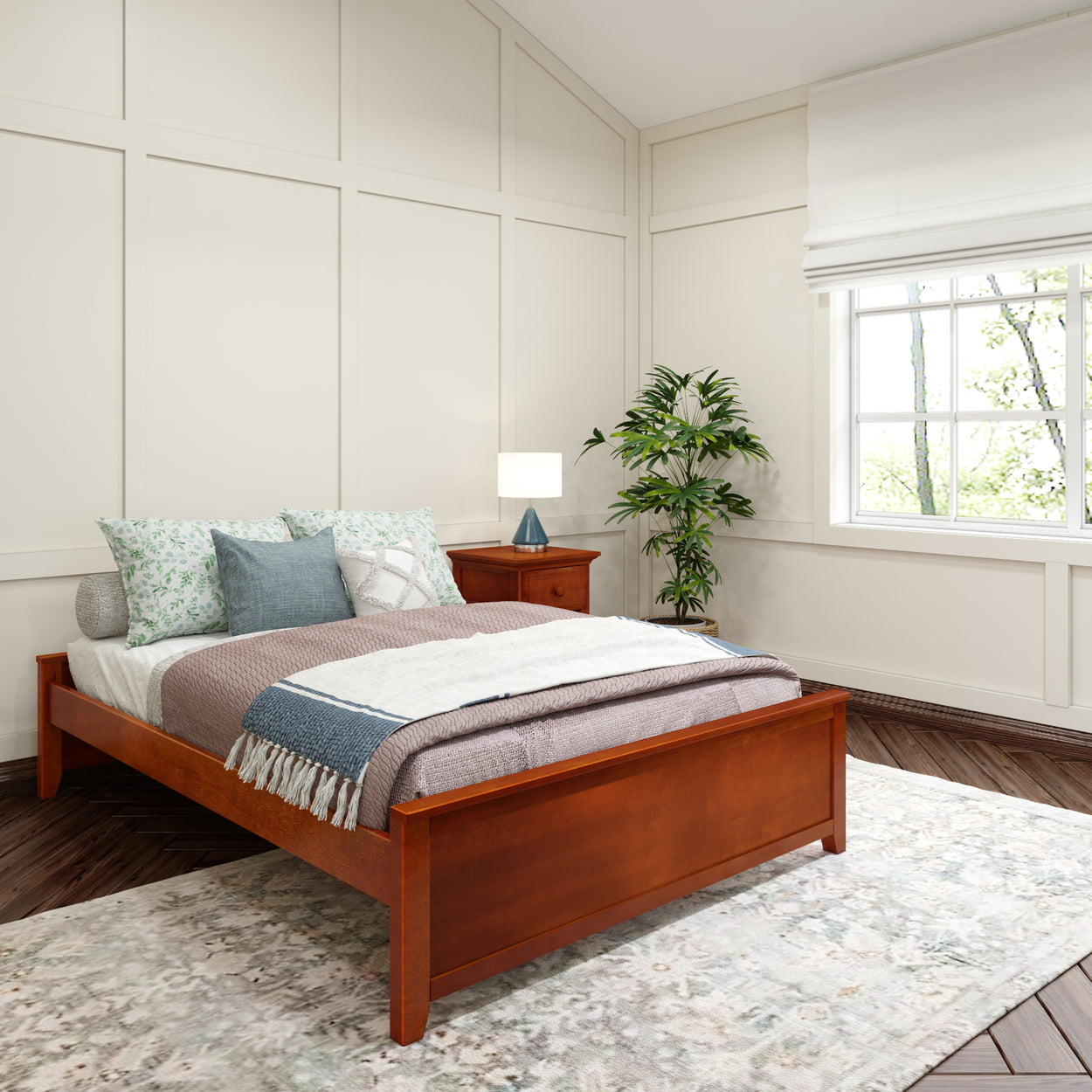 Cozy bedroom with wooden bed frame, decorative pillows, and potted plant by window.