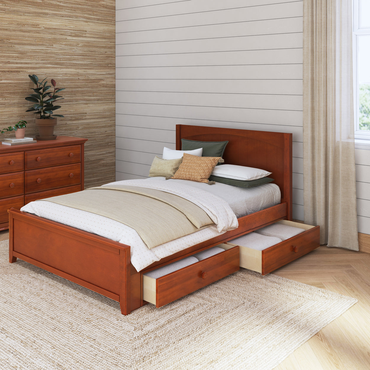 Wooden bed with storage drawers and cozy bedding in a modern bedroom setting.