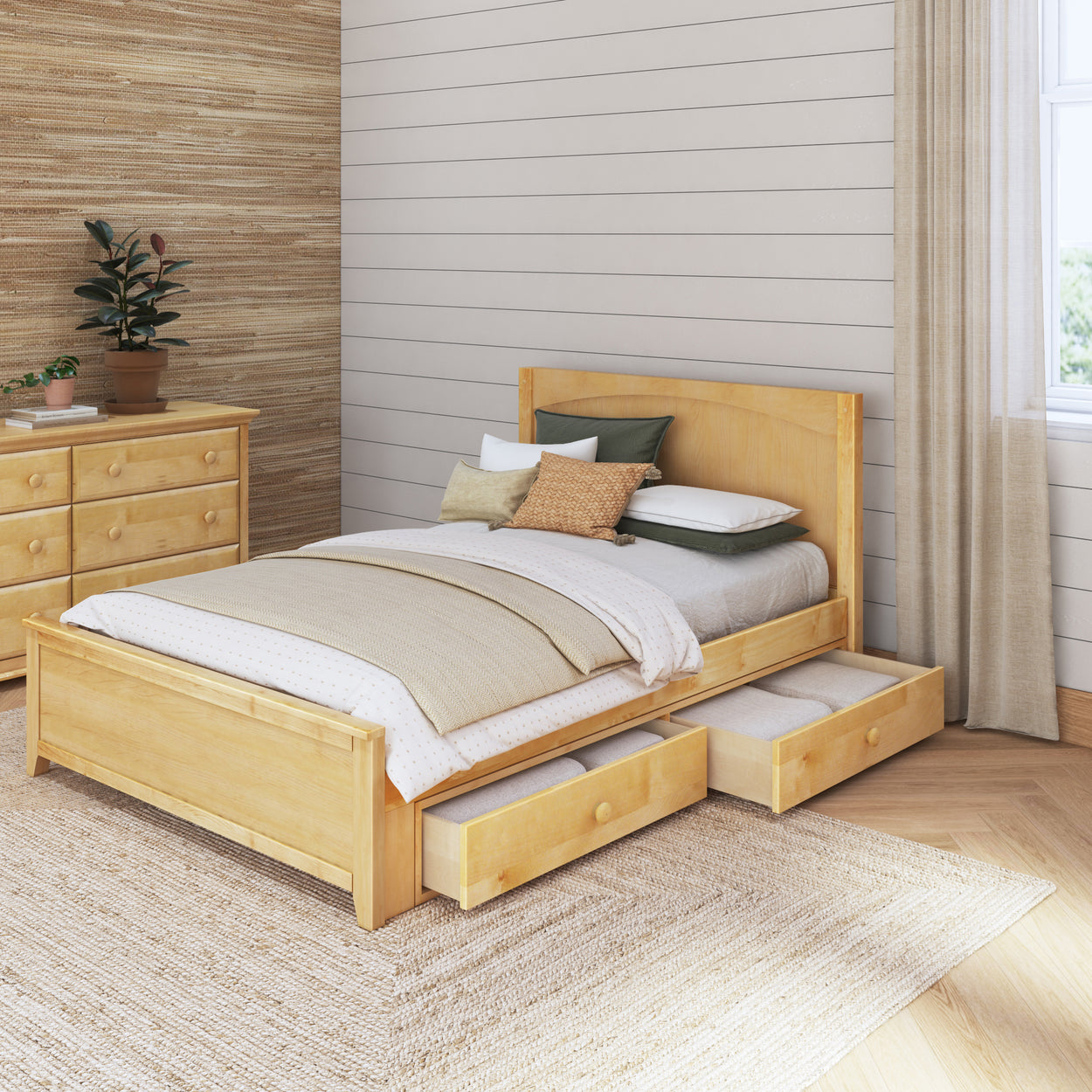 Modern wooden platform bed with built-in storage drawers in a cozy bedroom.