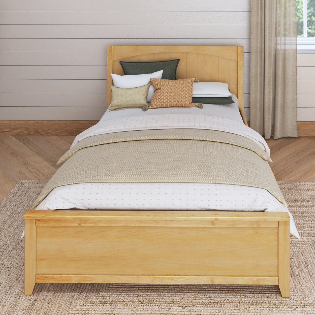 Wooden bed frame with beige bedding and decorative pillows in a cozy bedroom.