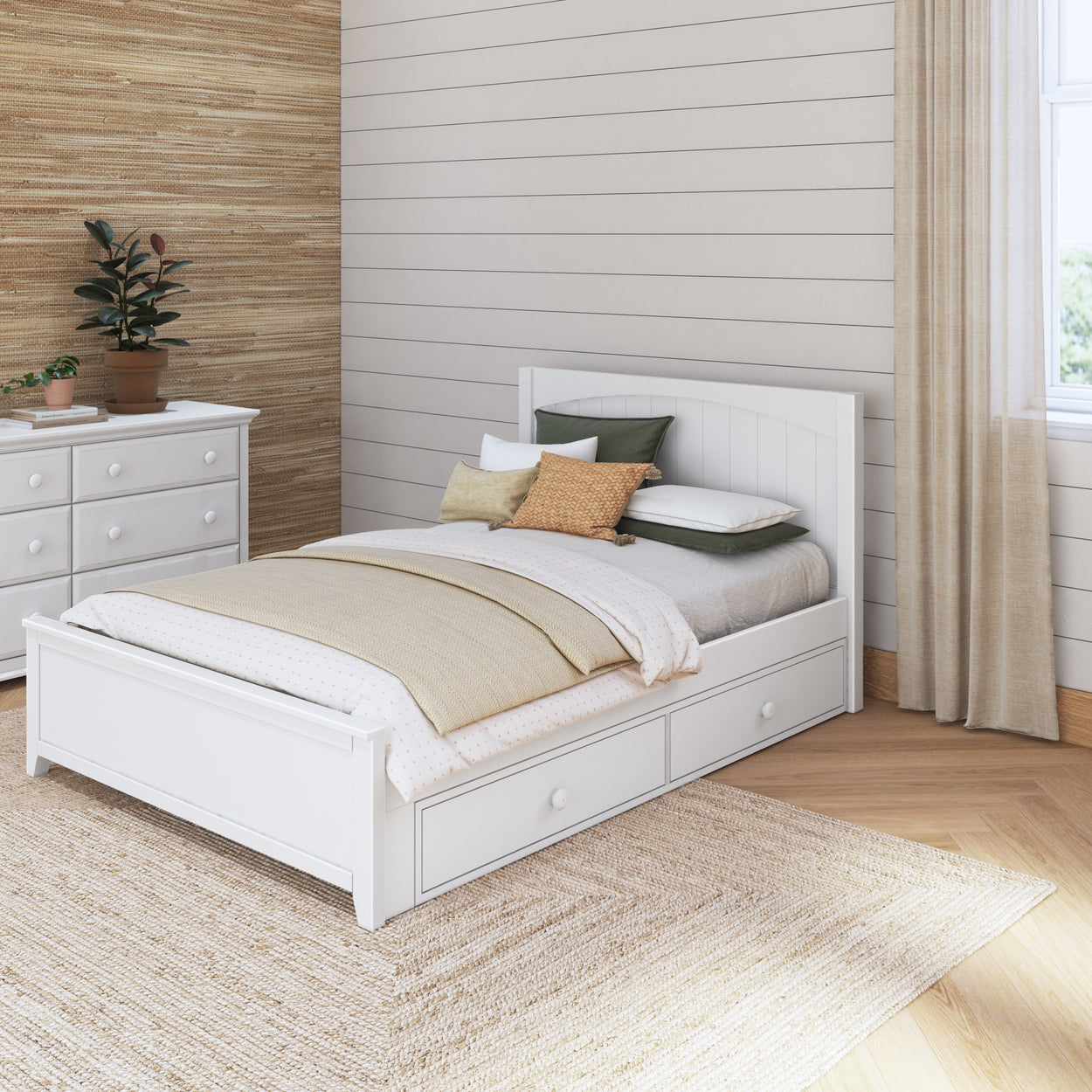 White wooden bed with storage drawers, beige bedding, and decorative pillows in a cozy, natural-themed bedroom with wooden flooring and neutral decor.