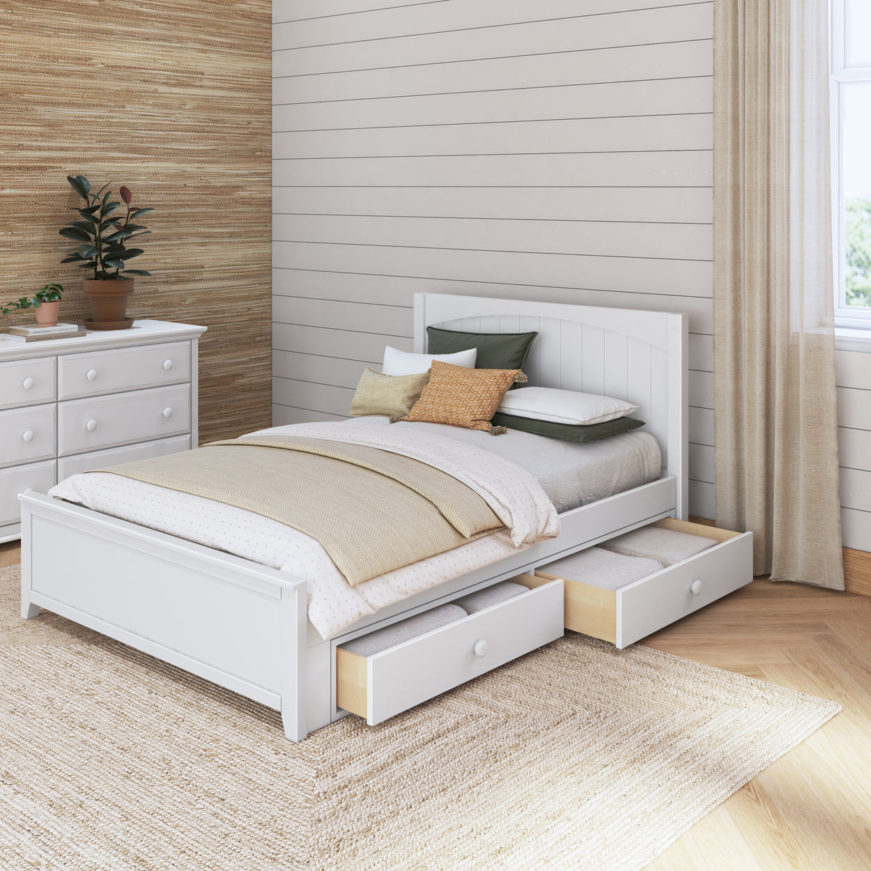 White wooden platform bed with underbed storage drawers, cozy beige and green bedding in a modern bedroom with textured walls and natural light.
