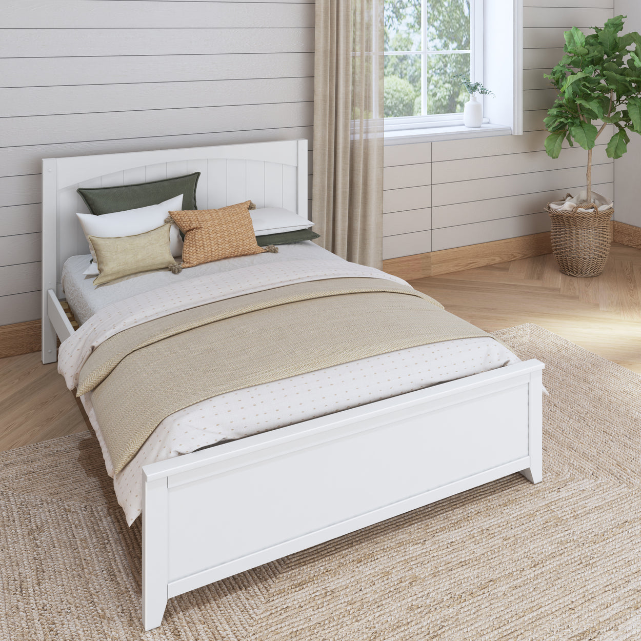 Cozy bedroom with a white wooden bed frame, beige bedding, decorative pillows, and a potted plant by the window.