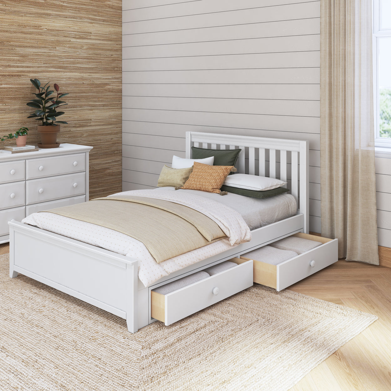 Modern bedroom with white wooden bed frame, storage drawers, and cozy bedding.