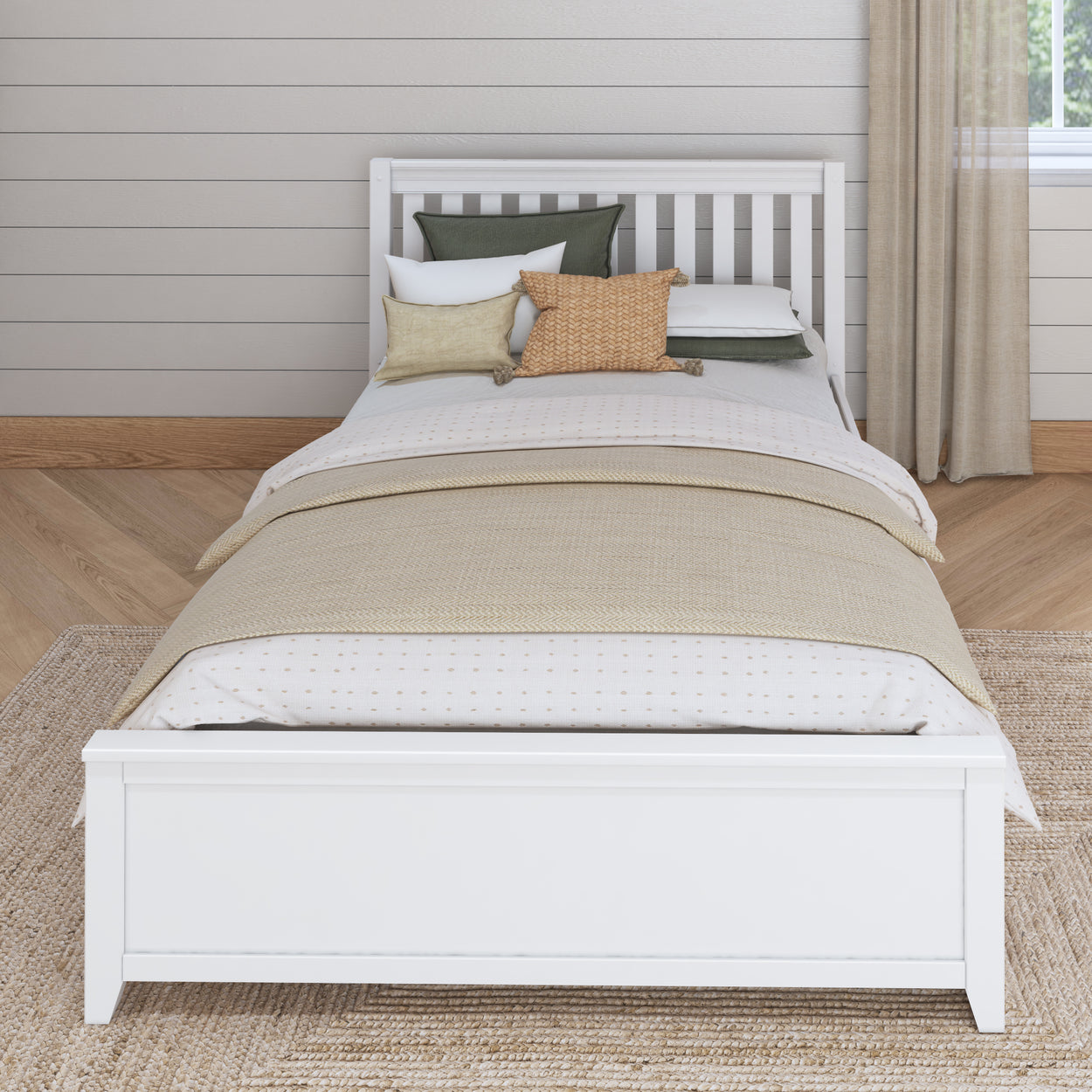 White wooden bed with cozy pillows and beige bedding in a stylish bedroom.