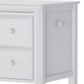 White wooden dresser with two drawers and side cabinet, perfect for bedroom storage.