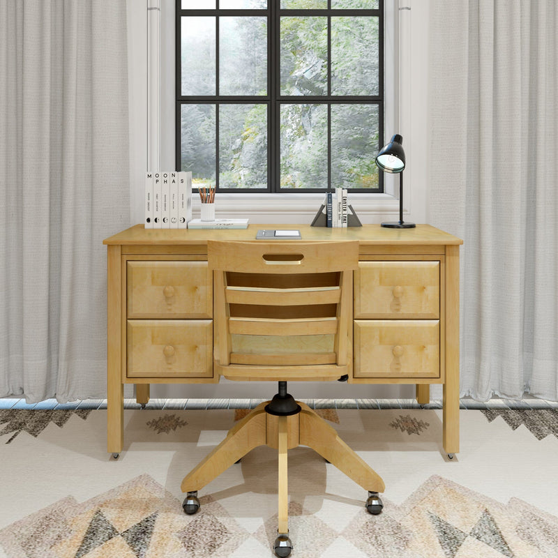 Minimalist light-wood home office setup with four-drawer desk and rolling wooden chair by a black-framed window showing greenery, desk lamp, books, and pencil cup.