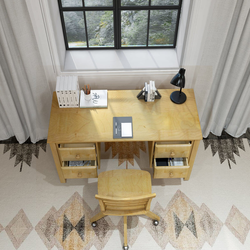 Minimalist light wood home office desk under a bright window with natural light, black desk lamp, notebook, pencil cup, stacked books, storage drawers and matching rolling wooden chair on a geometric rug