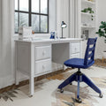 Bright modern home office with white desk and drawers, blue ergonomic swivel chair, desk lamp, books and plants by a snowy window