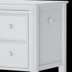 White wooden dresser with two smooth round knobs and clean modern design.
