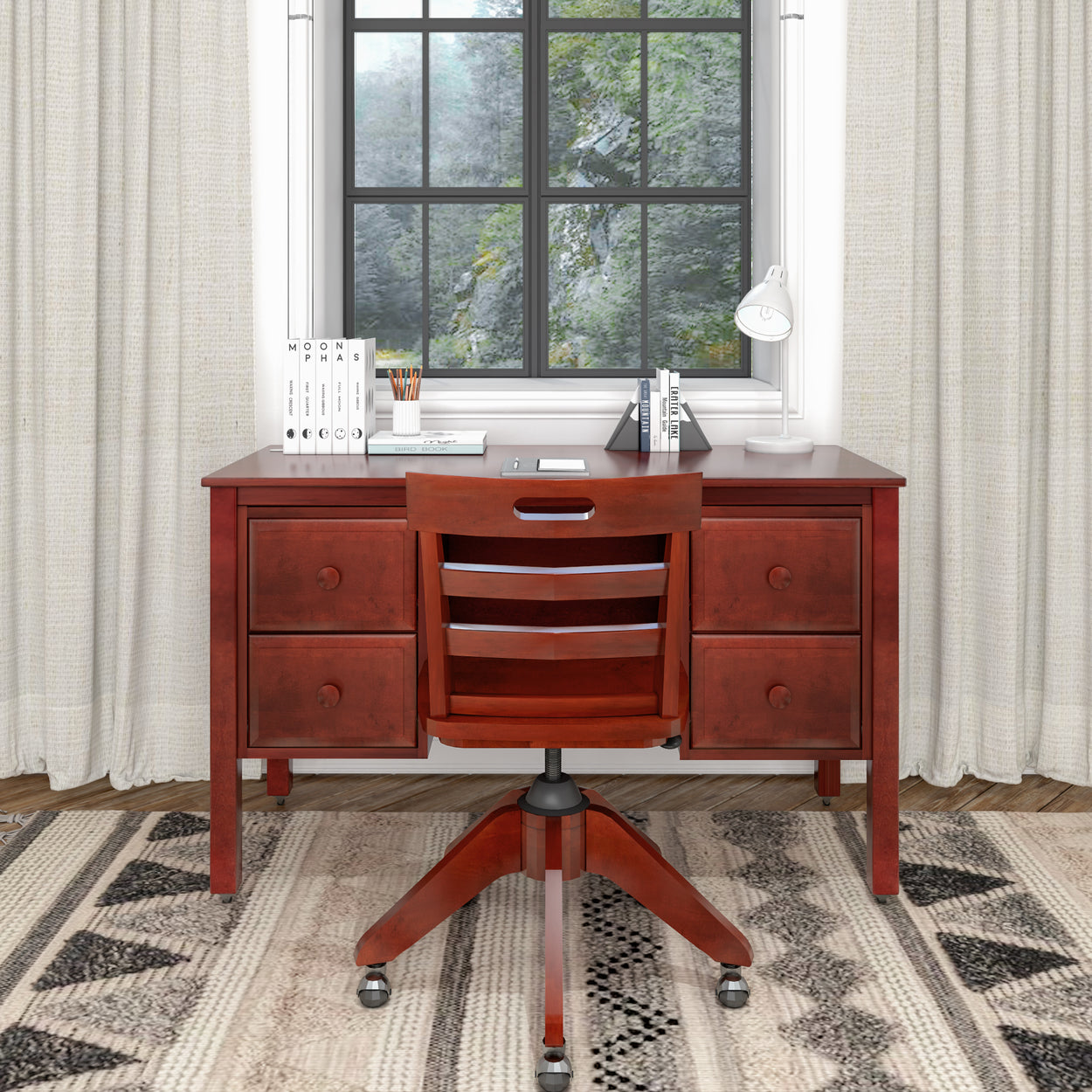 Wooden desk with drawers, chair, and decorative items in a cozy home office setting.
