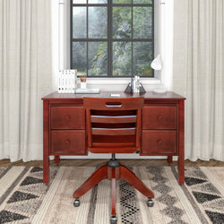 Wooden desk with drawers, chair, and decorative items in a cozy home office setting.