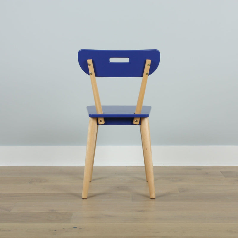 Blue wooden chair back with natural wood legs on light oak floor against a pale blue wall, minimalist interior
