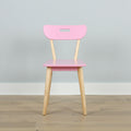 Minimalist pastel pink chair with light wooden legs against a pale gray wall — modern Scandinavian-style dining or children's chair