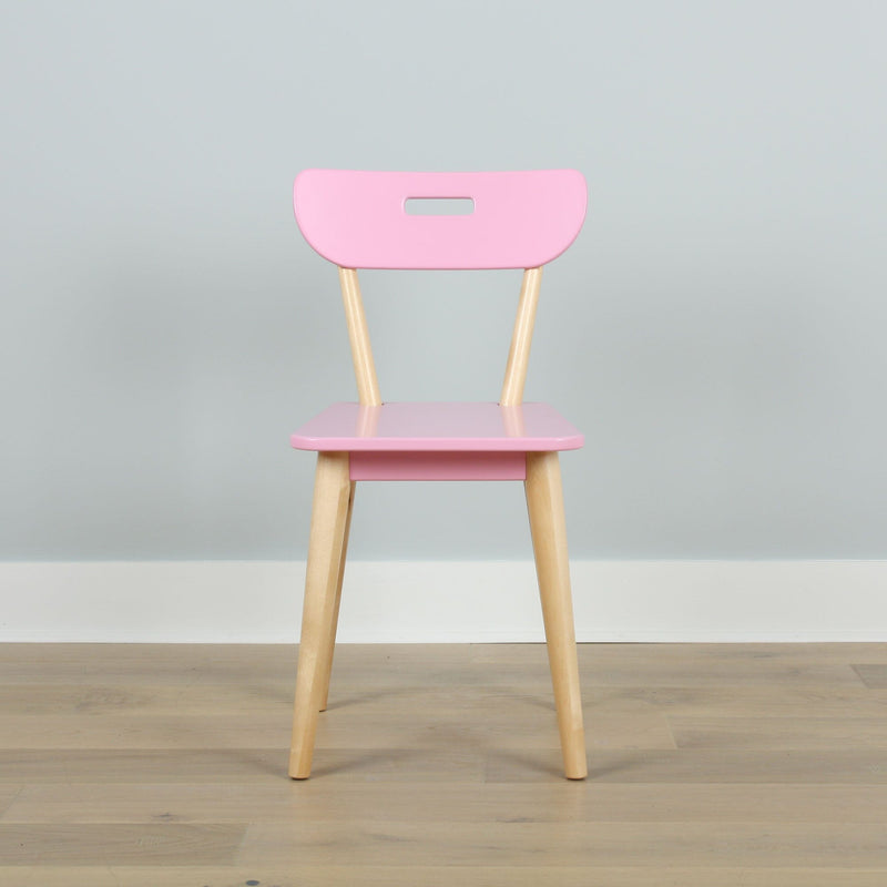 Minimalist pastel pink chair with light wooden legs against a pale gray wall — modern Scandinavian-style dining or children's chair
